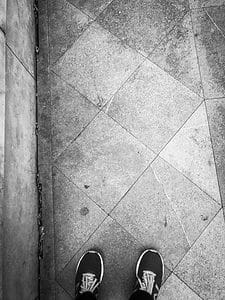 Feet on London sidewalk