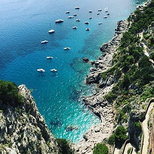 Super Easy ways to save money on travel and Blue green waters of Marina Piccola Capri Europe Travel