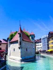 A view of Palais de l'Isle, a small castle on an island in the Thiou River in Annecy, one of the most charming old European towns in France.
