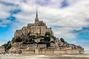 Mont Saint‑Michel rising above the tidal flats, perfect for a guide to unforgettable things to do in Normandy.