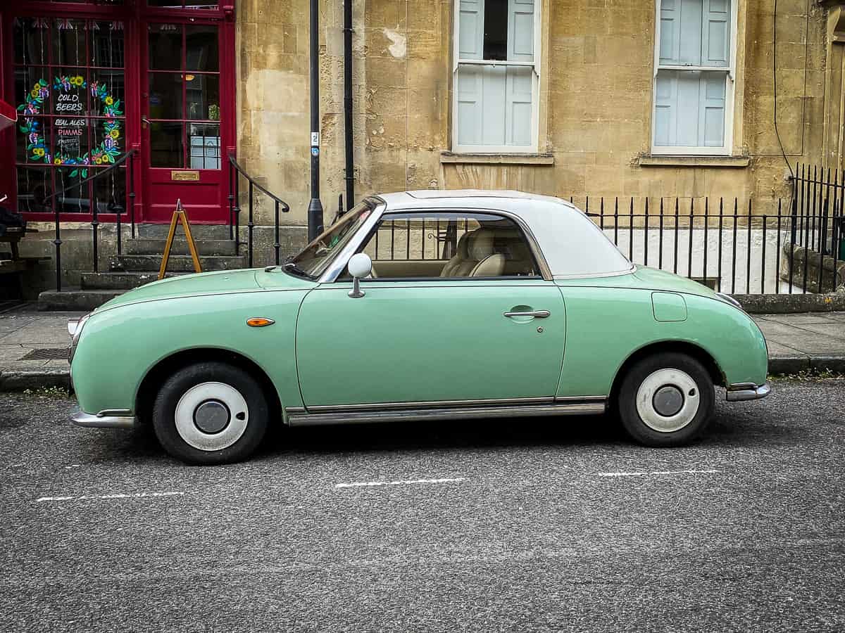 Small green car for Americans driving in the United Kingdom, finding the best travel planning apps
