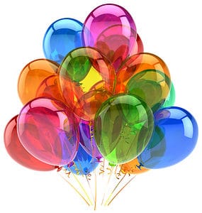 Colorful balloons floating together, symbolizing fun ways to give travel adventure surprises.