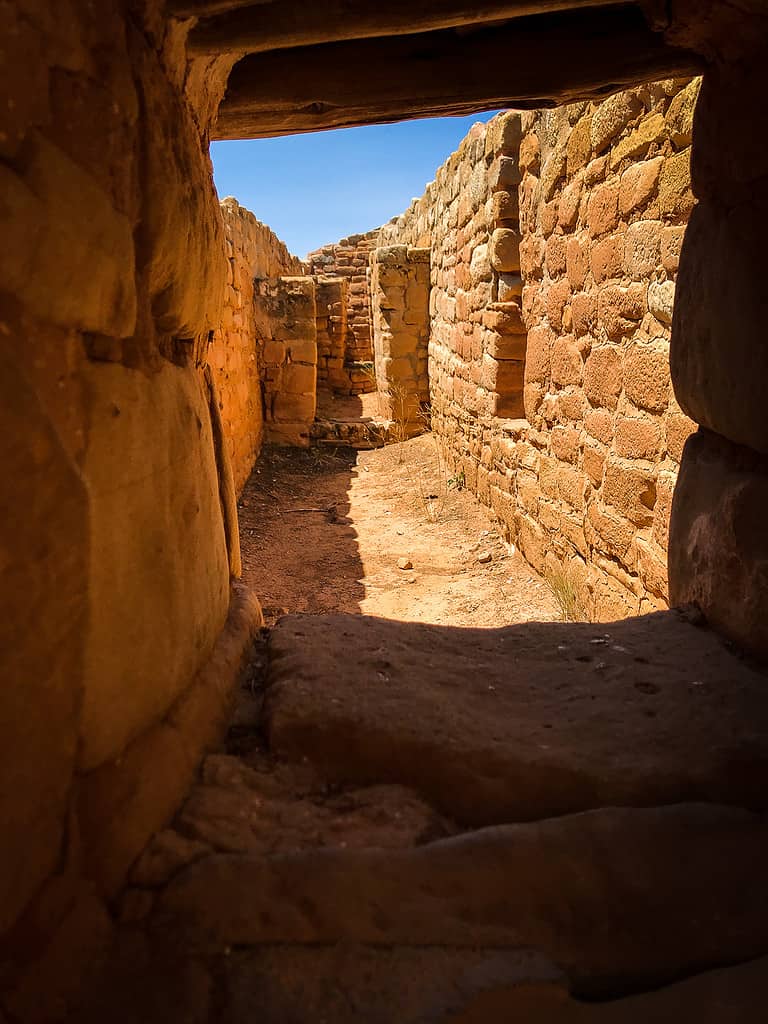 Narrow stone passageway at Far View Sites in Mesa Verde National Park, one of the top mesa verde tours on a national park road trip.