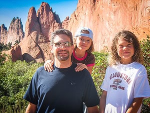 A dad and his kids love garden of the gods hiking trails in Colorado Springs, Colorado