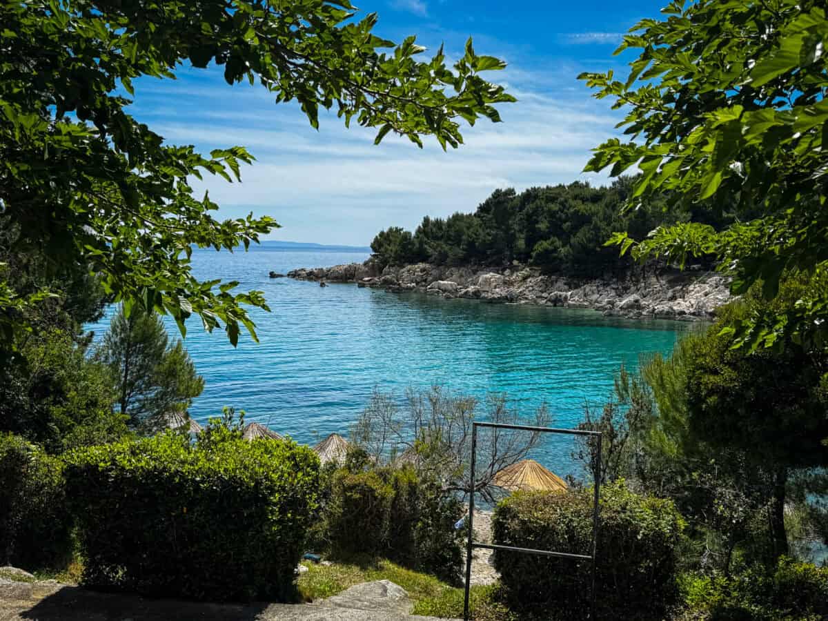 Crystal blue waters and beach umbrellas are perfect if you are spending 3 days on Rab Island in Croatia.