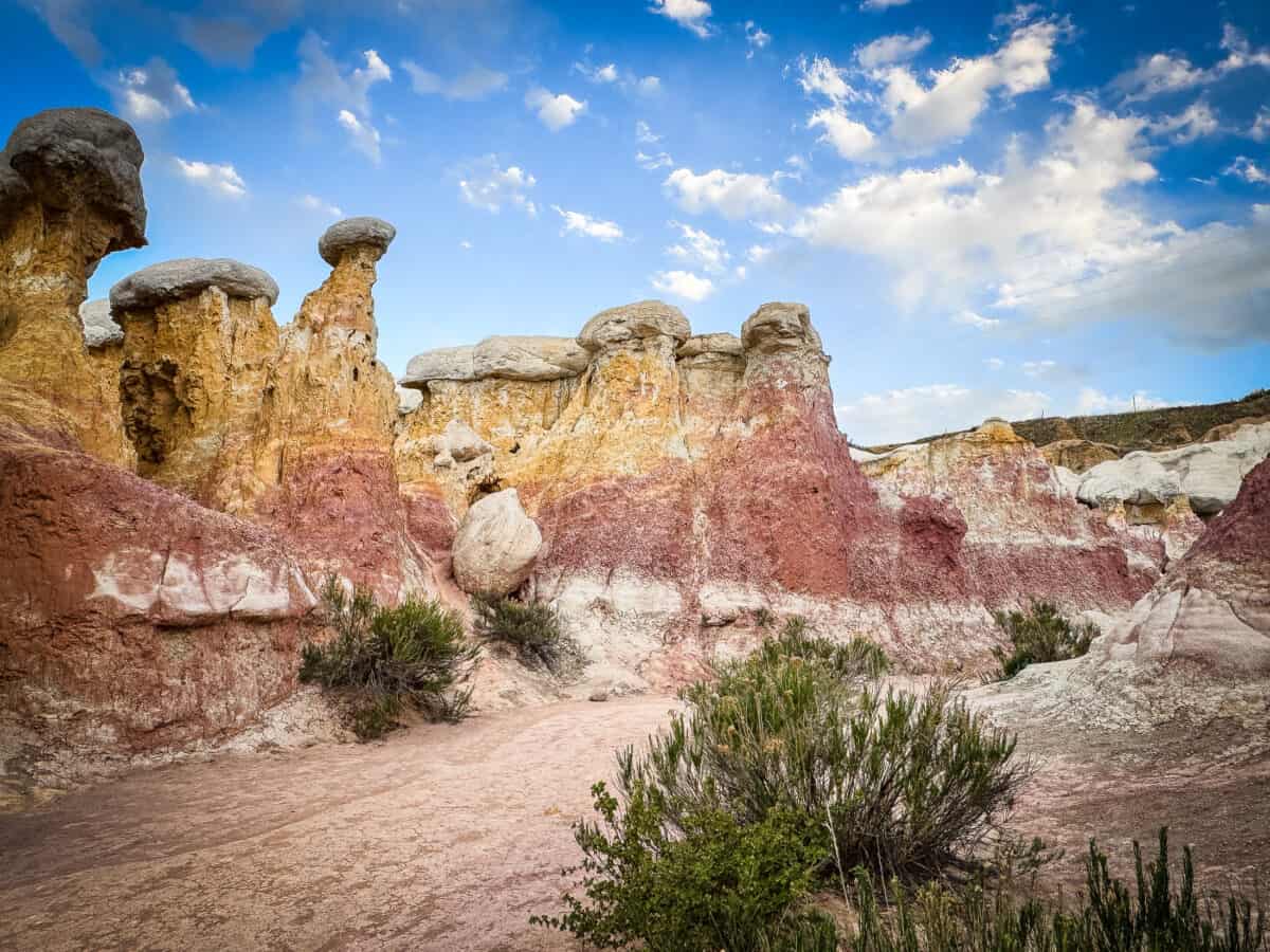 Alt text: Colorful sandstone hoodoos and clay spires at Paint Mines Interpretive Park in Colorado.