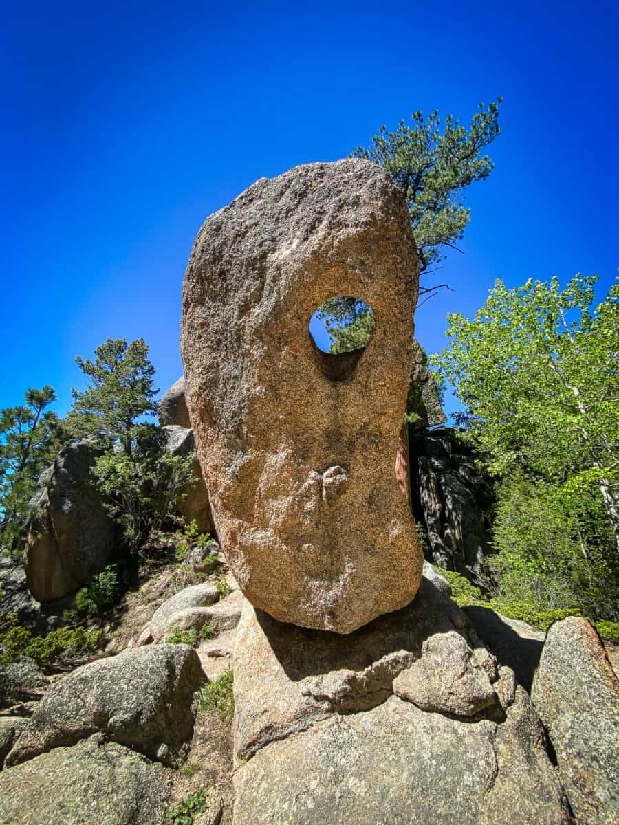 20230619 besthikesincoloradoneardenver 4404 Paul Bunyan's Boot, a granite rock formation with a natural hole, along the Gem Lake Trail in Rocky Mountain National Park.