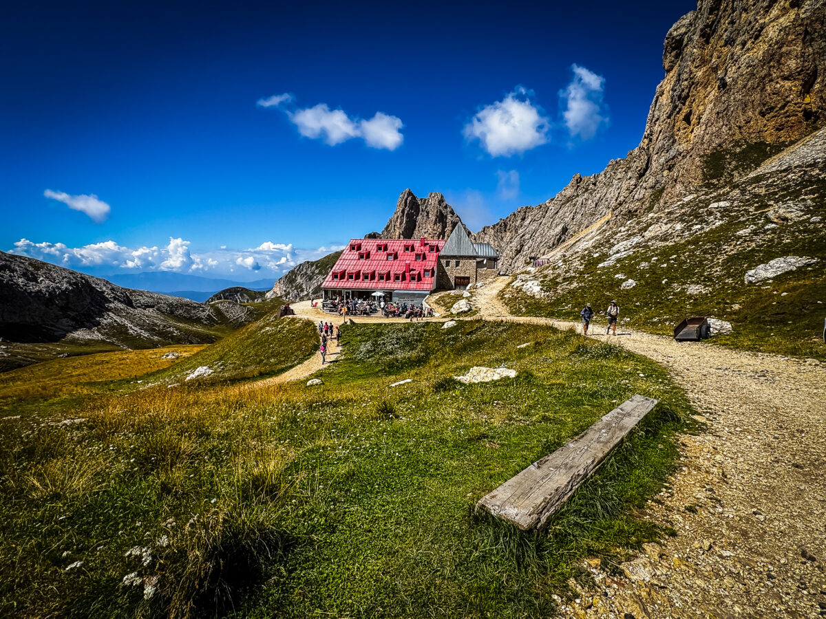 20260831 Dolomites 3451 Rifugio Alpe di Tires sits at the base of jagged Dolomite spires, reached from the far side of the Alpe di Tires trail.