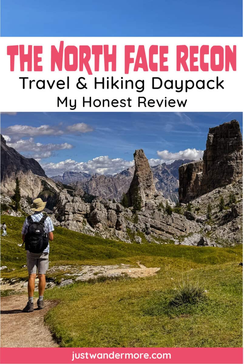 besttraveldaypackforeurope1 Hiker wearing a black The North Face Recon daypack on a trail in the Dolomites, Italy, with text "The North Face Recon Travel & Hiking Daypack: My Honest Review."